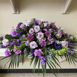 Large purple and lavender floral spray with roses and mums
