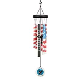Patriotic wind chime with red, white, and blue tubes and a round medallion
