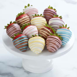 Plate of chocolate-covered strawberries on a white pedestal stand