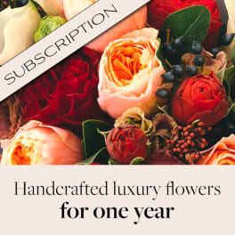 Bouquet of red, peach, and cream roses with a subscription banner