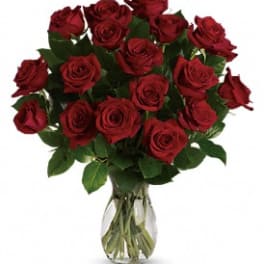 Bouquet of red roses in a clear glass vase