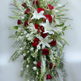 Tall red and white floral spray with lilies and roses