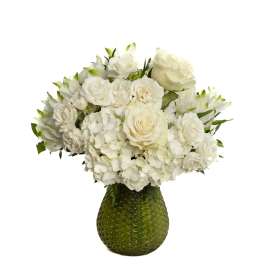 White roses and hydrangeas arranged in a green textured vase