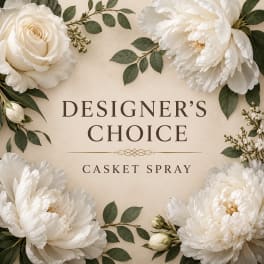 White floral casket spray with roses and peonies on a beige background
