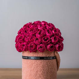 Hot pink rose arrangement in a textured blush hatbox