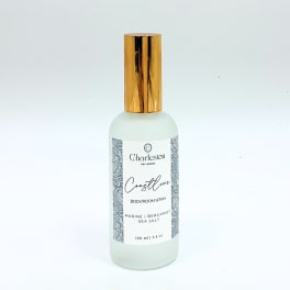 Bottle of Charleston Coastline body and room spray with a gold cap