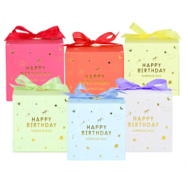Six colorful birthday gift boxes with ribbon bows and gold lettering