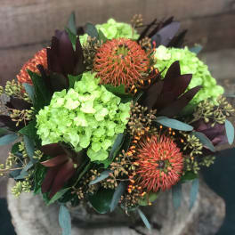 Bouquet with lime hydrangeas and orange pincushion blooms