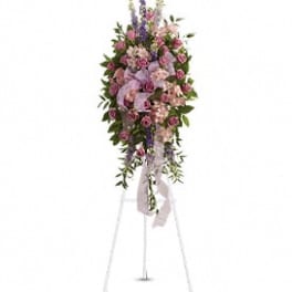 Tall pink and lavender floral standing spray on an easel