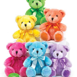Five colorful teddy bears with ribbons on white stands