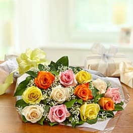 Bouquet of multicolored roses wrapped in clear paper