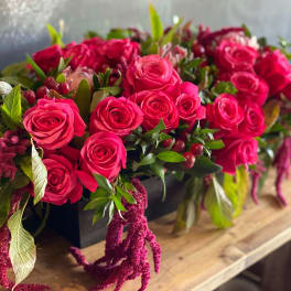 Pink rose arrangement in a black rectangular container