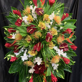 Large tropical standing spray with red, yellow, and white flowers