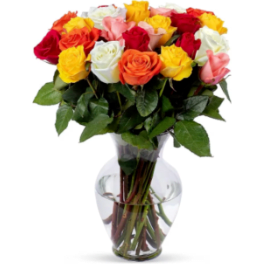 Mixed roses in a clear glass vase
