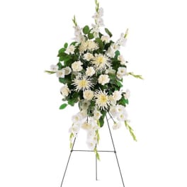 White floral standing spray on an easel