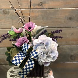 Bouquet of pink and white flowers with a blue checkered ribbon