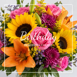 Bright mixed bouquet with sunflowers, pink roses, orange lilies, and purple mums
