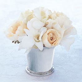 White and cream bouquet in a small silver vase