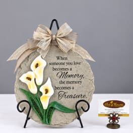 Decorative memorial plaque with white calla lilies and a ribbon bow