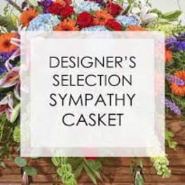 Sympathy casket spray with mixed colorful flowers