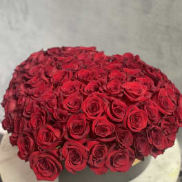 Large bouquet of red roses in a black box
