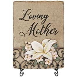 Decorative plaque reading "Loving Mother" with white flowers