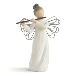 Wooden angel figurine holding a flute