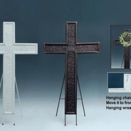 Decorative standing crosses on easels, one with a small wreath