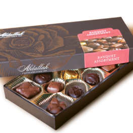 Open box of assorted chocolates with a matching lid