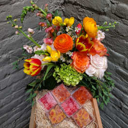 Mixed bouquet in a wooden box with assorted candy boxes