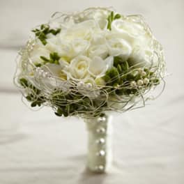 White rose bouquet with pearl and wire accents in a wrapped handle