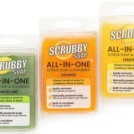 Three packaged Scrubby Soap bars in citrus scents on a white background