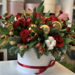 Red roses and mixed flowers in a white hat box with gold ornaments