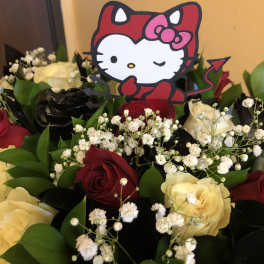 Bouquet of red and cream roses with baby's breath and a Hello Kitty topper