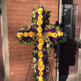 Yellow rose cross on an easel with purple accents