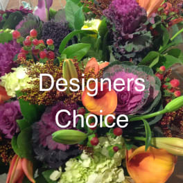 Colorful mixed bouquet with purple ornamental cabbage, orange calla lilies, and green hydrangea