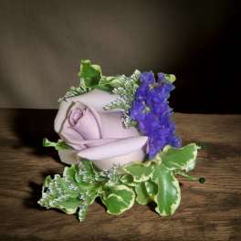 Lavender rose with purple filler and variegated greenery