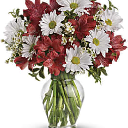 Red and white mixed bouquet in a clear glass vase