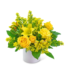 Yellow roses and lilies in a white vase
