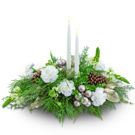 Candle centerpiece with white flowers and greenery