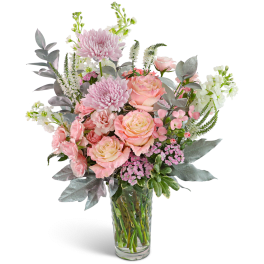 Pink and peach bouquet in a clear glass vase