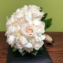White and blush bridal bouquet with roses and orchids