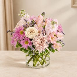 Pink and white mixed bouquet in a clear glass vase