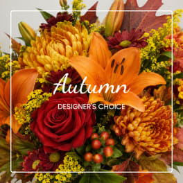 Autumn bouquet with orange lilies, red roses, and yellow chrysanthemums