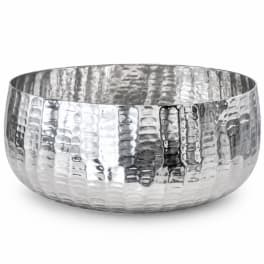 Hammered silver metal bowl on a white background