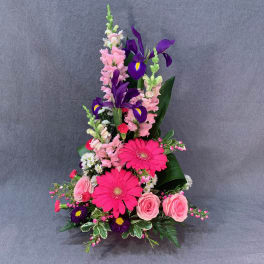 Tall bouquet with pink roses, hot pink gerberas, and purple irises