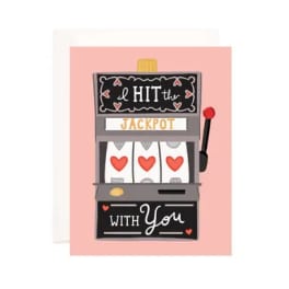 Greeting card with a slot machine and hearts on a pink background