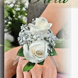 White rose wrist corsage with baby's breath and ribbon