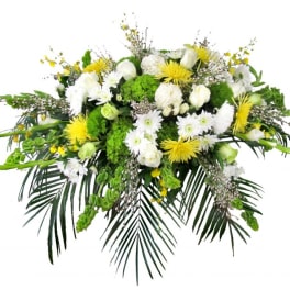 White and yellow floral spray with palm fronds