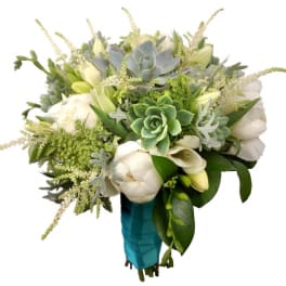 Bouquet of white flowers and succulents wrapped in teal ribbon